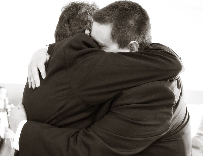 Father Hugging Son