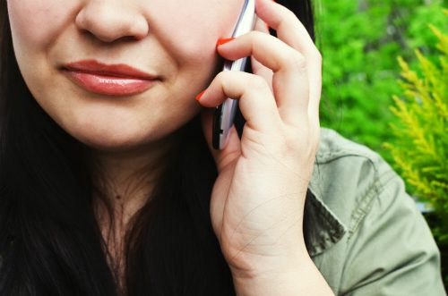 person-woman-smartphone-calling-talking-helpline-small