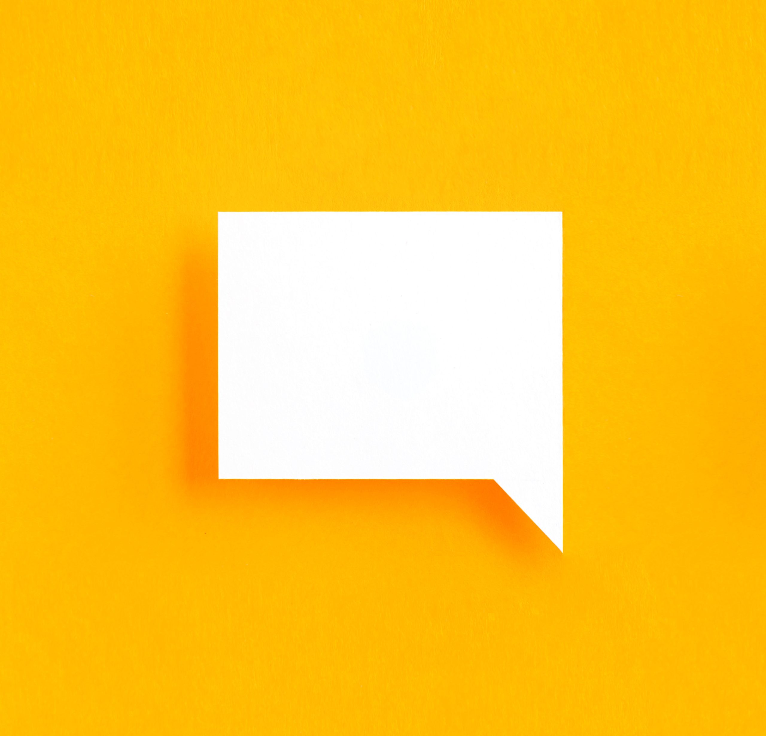 white square speech bubble on yellow background
